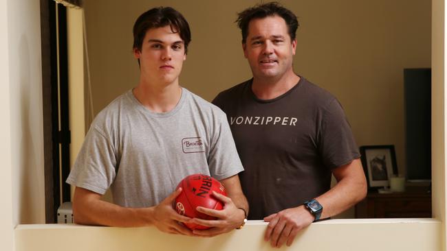 Jack Bowes at home in Cairns with his dad Wayne. PICTURE: JUSTIN BRIERTY