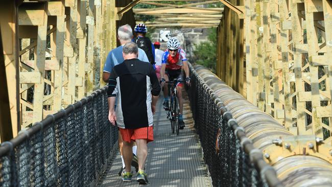 Pedestrians crossing the narrow Fairfield Pipe Bridge have been abused by cyclists even though signs prohibit crossing on a bike. Picture: James Ross