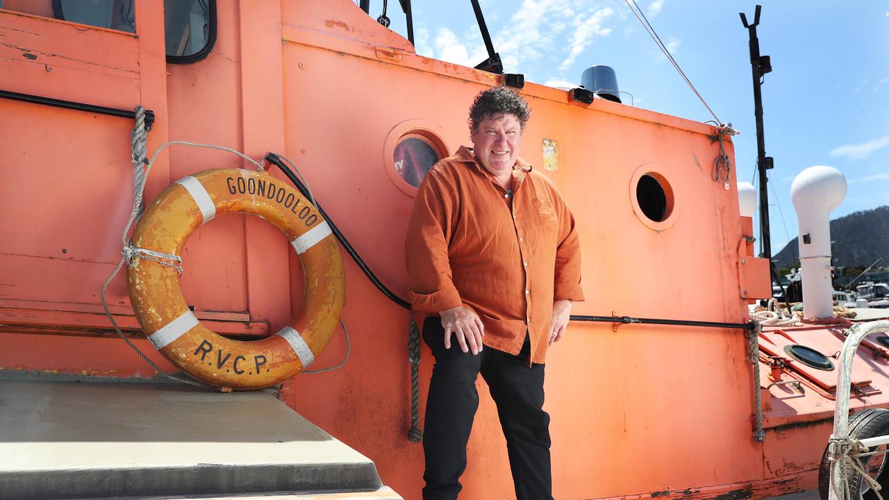 Craig Bellgrove with wooden boat Goondooloo when he salvaged it from the Tamar River to be restored in Hobart in December 2022. Picture: Nikki Davis-Jones