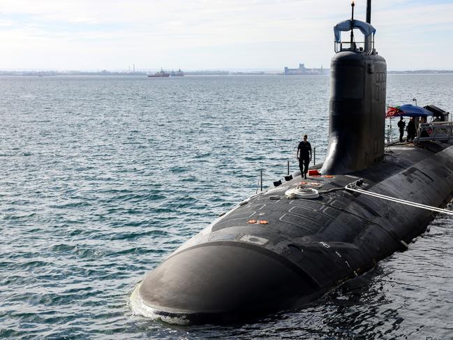 ROCKINGHAM, AUSTRALIA - FEBRUARY 26: U.S. Navy officers stand guard aboard Virginia-class fast attack submarine USS Minnesota (SSN-783) after the vessel docked at HMAS Stirling on February 26, 2025 in Rockingham, Australia. The submarine was on a port visit. (Photo by Colin Murty - Pool/Getty Images)