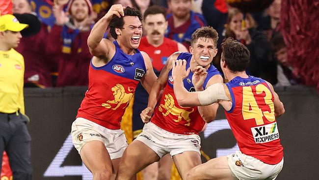 Zac Bailey celebrates a goal in the final quarter as the Lions surge home. Picture: Michael Klein