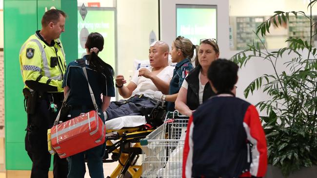 One of the injured men talks to police. Picture: Nigel Hallett