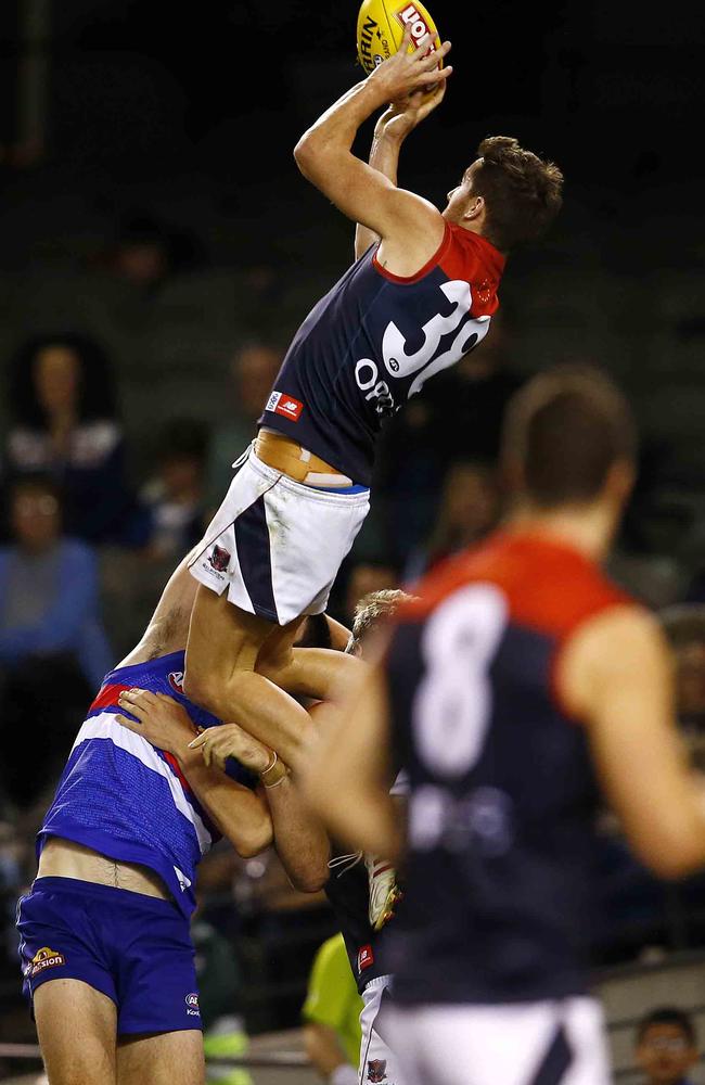 Jeremy Howe jumps on top of Tom Campbell.