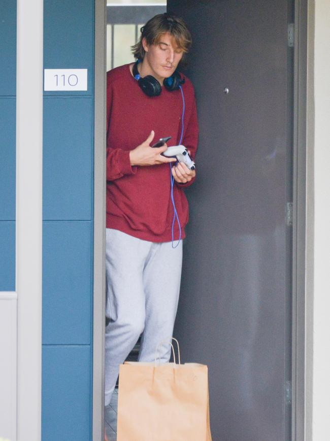 Crow Joshua Worrell grabs his lunch bag left outside his door …