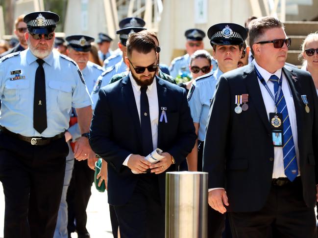 Mourners at the memorial service with full police honours for constables Rachel McCrow and Matthew Arnold at Brisbane Entertainment Centre. Picture: David Clark