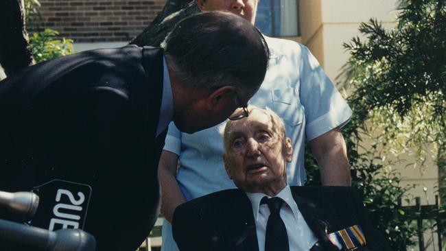 Then Prime Minister John Howard congratulates Ted Matthews on his 100th birthday in 1996.