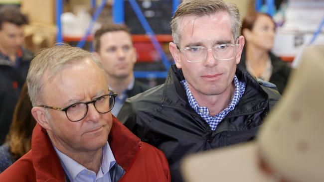 Prime Minister Anthony Albanese and NSW Premier Dominic Perrottet talk to flood victims at Hawkesbury. Picture: Jenny Evans/Getty Images