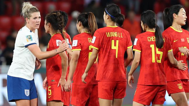 Millie Bright of England at the end of the game with Chinese players