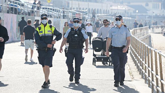 Police patrol Bondi Beach one week after new restrictions were put in place. Picture: Adam Yip