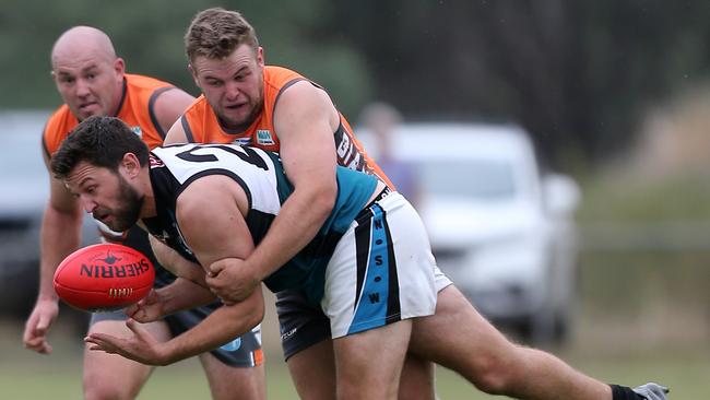 CDHBU Callum Butle is tackled by RWW Giants opponent. Picture: Yuri Kouzmin