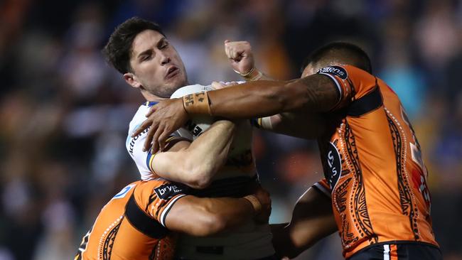 Mitchell Moses is wrapped uyp by the Tigers’ defence. Picture: Jason McCawley/Getty Images