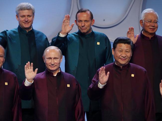 All smiles on the outside: Prime Minister Tony Abbott with APEC Leaders including Russian President Vladimir Putin. Picture: Andrew Meares