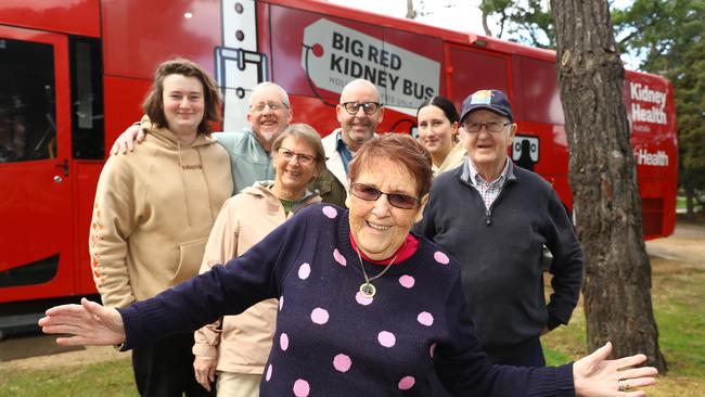 Claire Gibbons, picture with her family, and the kidney bus she follows around for her dialysis. Picture: Alison Wynd