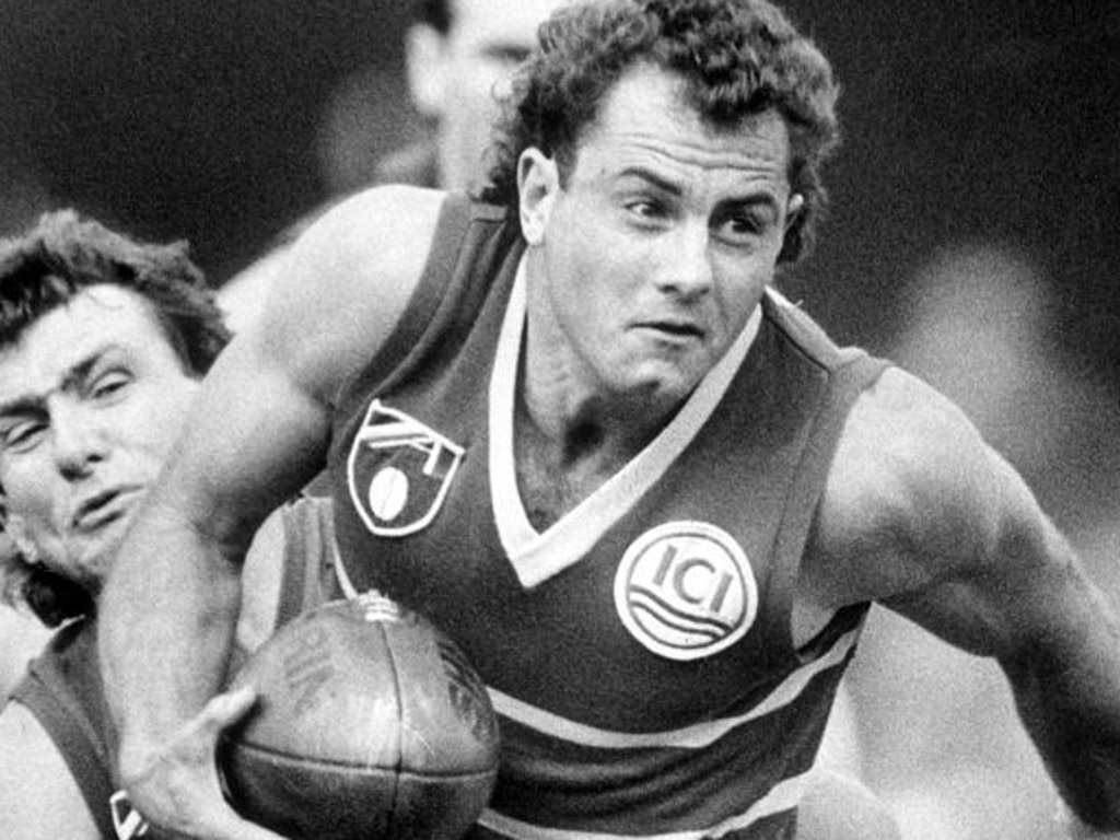 Phil Walsh, left, tackles Tony McGuinness during his time with Brisbane.