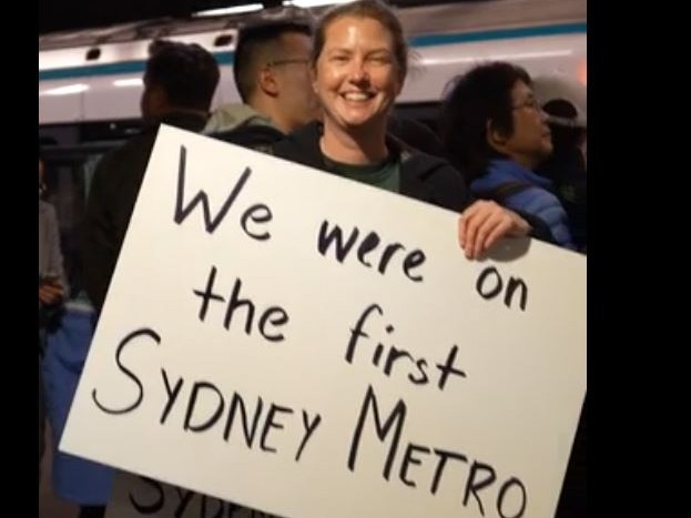 An excited commuter taking a ride on the first service.