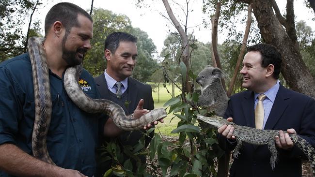 The CEOs of Sydney Zoo, Jake Burgess and Muru Mittigar, Peter Chia with Minister for Tourism Stuart Ayres meeting animals at the launch of the SydneyZoo/Muru Mittigar partnership. Picture: David Swift