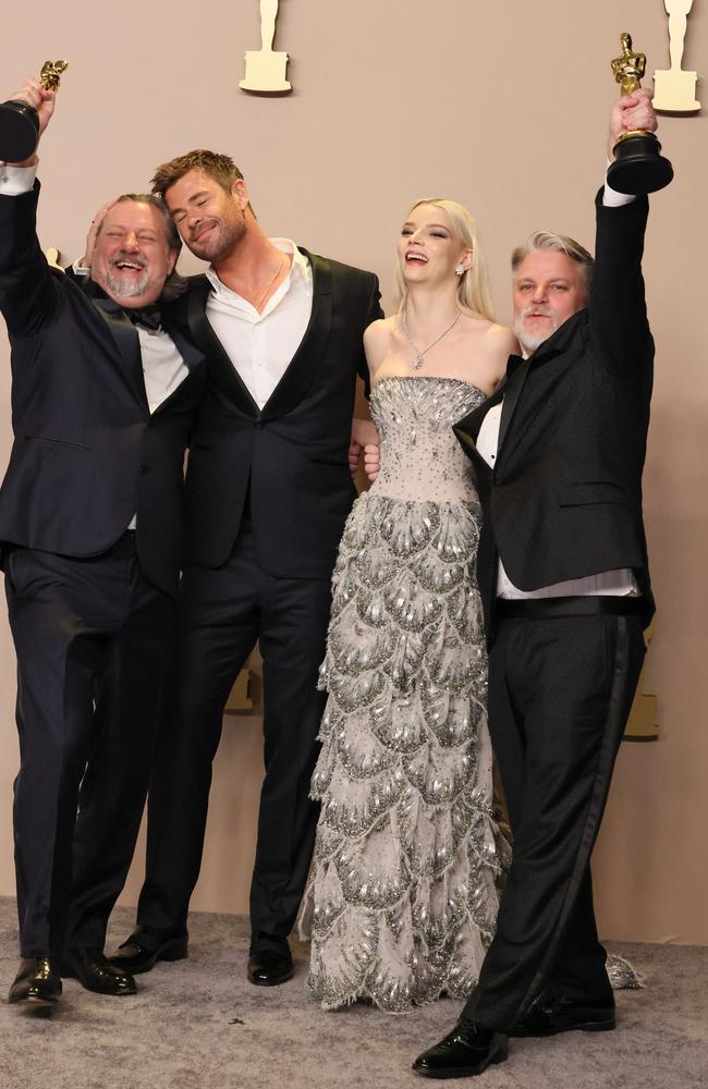 Dave Mullins, presenters Chris Hemsworth and Anya Taylor-Joy, and Brad Booker, winners of Best Animated Short Film award for 'War is Over' pose in the press room. Picture: Getty Images/AFP