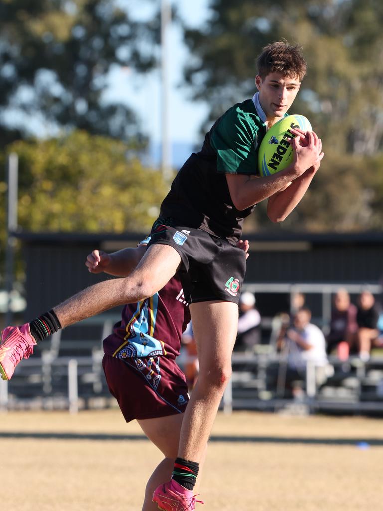 Titans Cup Finals. Tweed River High (green and Black) v Keebra Park (blue) in Open Boys Development division at Southport Tigers . Picture Glenn Hampson.