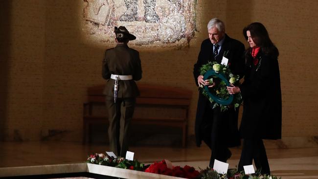 Chair of the Australian War Memorial Kerry Stokes and wife Christine Simpson Stokes lay a wreath at the Tomb of the Unknown Australian Soldier during the Anzac Day commemorative service at the Australian War Memorial on Saturday in Canberra.