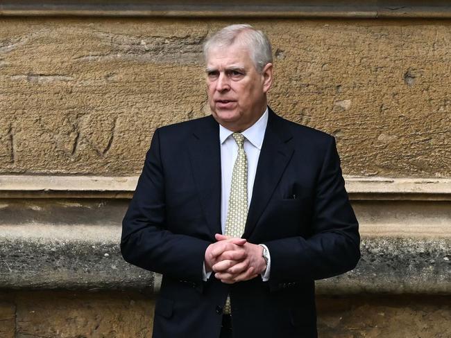 (FILES) Britain's Prince Andrew, Duke of York reacts as he arrives at St. George's Chapel, Windsor Castle, to attend the Easter Mattins Service, on March 31, 2024. A former UK security minister said Friday, december 13, that it was "extremely embarrassing" that a suspected Chinese spy had become a confidant of disgraced royal Prince Andrew. (Photo by JUSTIN TALLIS / AFP)