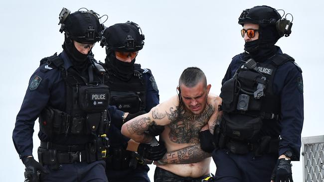 A man has surrendered himself to police following a boat standoff on the Sunshine Coast after he allegedly crashed a car through a home with teary owners saying it sounded like a bomb going off. Picture: Patrick Woods.