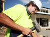 Apprentice Patrick Gribbon working at a school