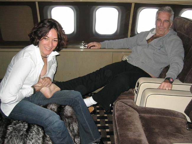 This undated trial evidence image shows British socialite Ghislaine Maxwell giving a foot massage to US financier Jeffrey Epstein. Picture: AFP