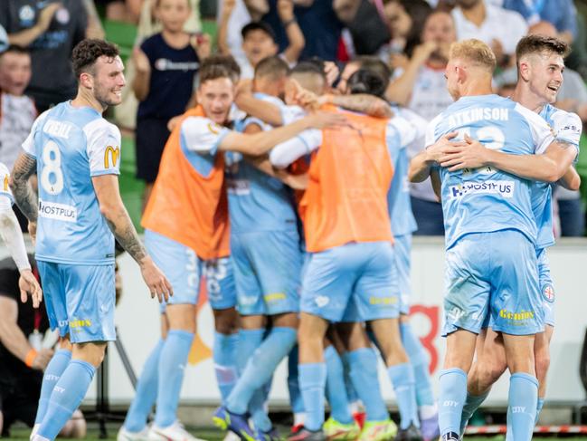 MELBOURNE, AUSTRALIA - DECEMBER 18: Nathaniel Atkinson of Melbourne City celebrates a goal with teammates during the A-League mens match between Melbourne City and Melbourne Victory at AAMI Park, on December 18, 2021, in Melbourne, Australia. (Photo by Mackenzie Sweetnam/Getty Images)