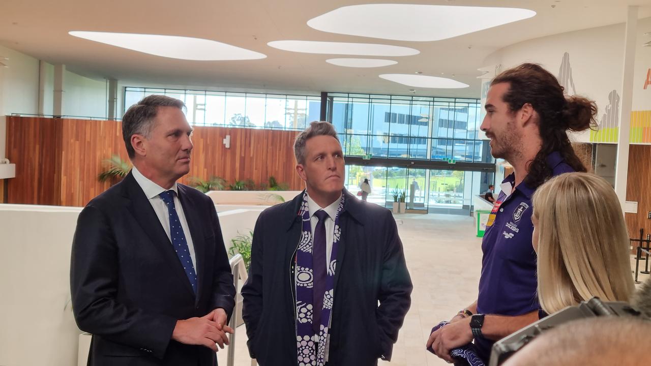 Mr Marles (left) was visiting with Fremantle MP Josh Wilson (centre) to discuss the AFL club's commitment to yes vote in the Voice to Parliament referendum, joined by Docker's captain Alex Pearce (right). Picture: NCA NewsWire / Anthony Anderson