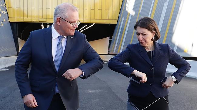 Prime Minister Scott Morrison and NSW Premier Gladys Berejiklian bump elbows after touring the NorthConnex tunnel. Picture: Mark Metcalfe/Getty