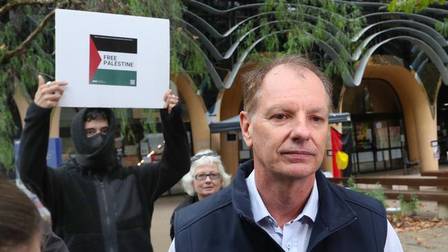 Liberal Party MP and Jewish man David Southwick spoke to media at the campus on Friday, saying ‘I don’t feel terribly safe’ with a masked pro-Palestine demonstrator who ‘gatecrashed’ his press conference. Picture: NCA NewsWire / David Crosling