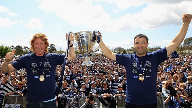 Cameron Ling and coach Chris Scott with the 2011 premiership cup. Picture: Hamish Blair/Getty Images)