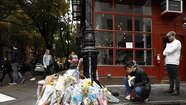 Fans pay tribute to late actor Matthew Perry outside the Friends apartment building. Picture: Getty Images