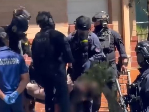 Heavily armed police during the standoff in West Kempsey. Picture: NBN