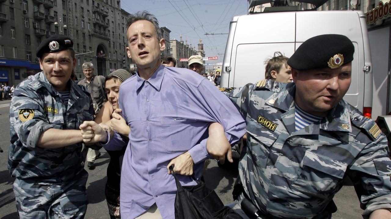 Tatchell has been protesting anti-gay regimes for decades, seen here being detained by Russian riot police. Picture: AP