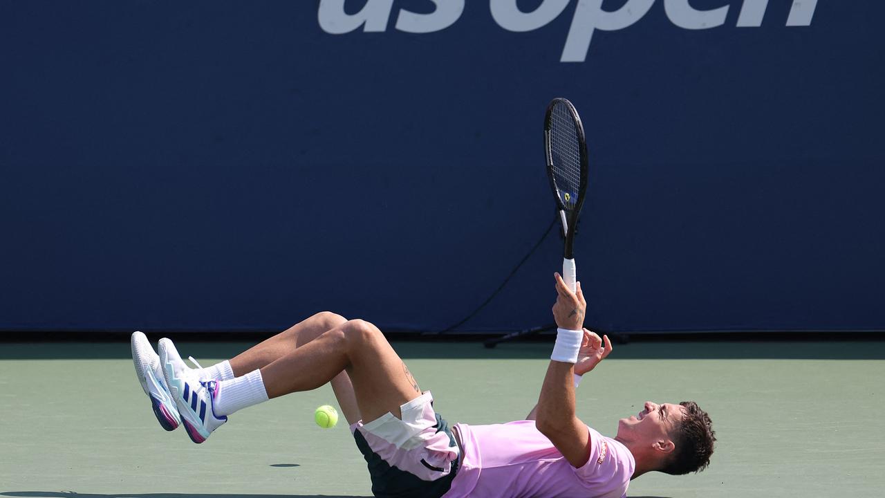 NEW YORK, NEW YORK - AUGUST 27: Thanasi Kokkinakis of Australia reacts against Stefanos Tsitsipas of Greece during their Men's Singles First Round match on Day Two of the 2024 US Open at the USTA Billie Jean King National Tennis Center on August 27, 2024 in the Flushing neighbourhood of the Queens borough of New York City. Luke Hales/Getty Images/AFP (Photo by Luke Hales / GETTY IMAGES NORTH AMERICA / Getty Images via AFP)