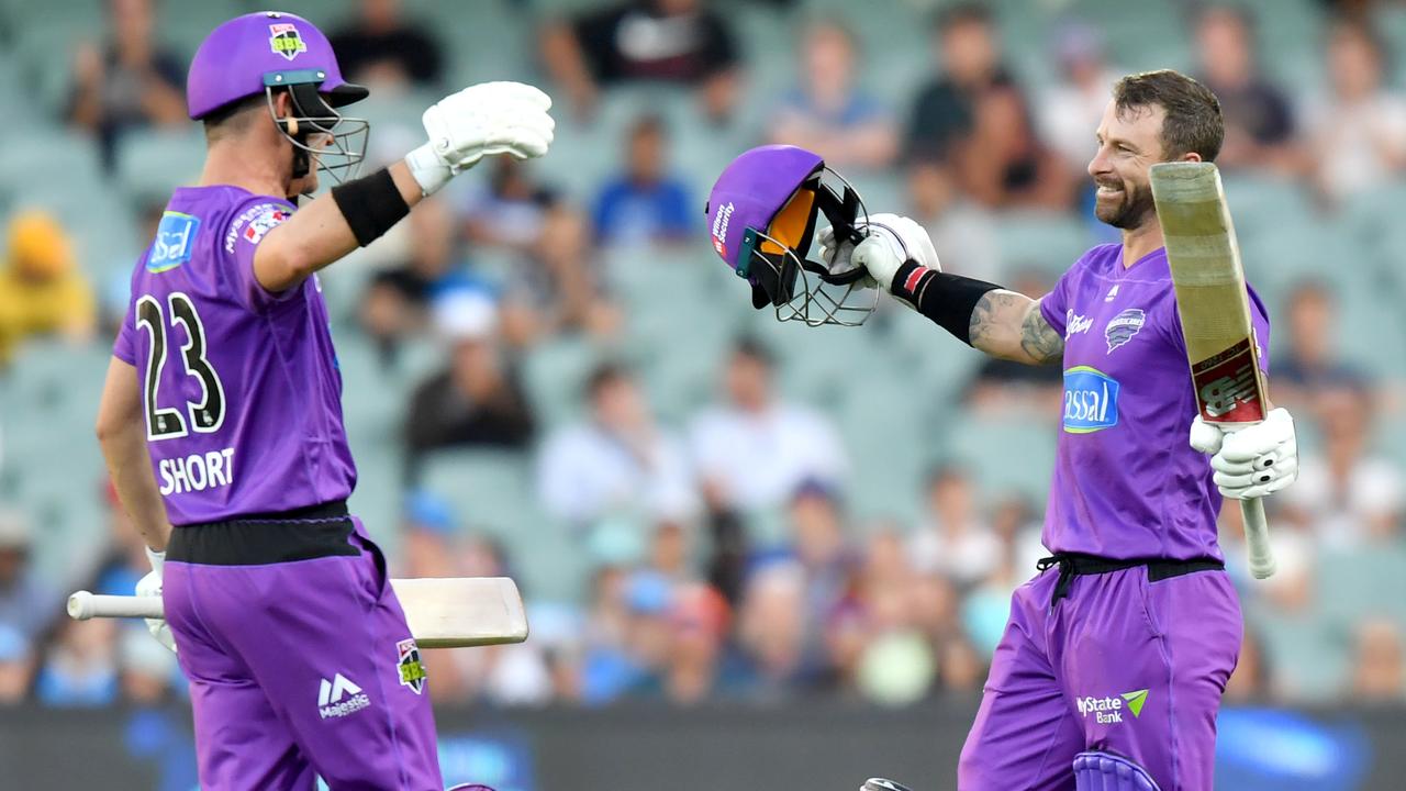 Matthew Wade celebrates his century with D’Arcy Short.