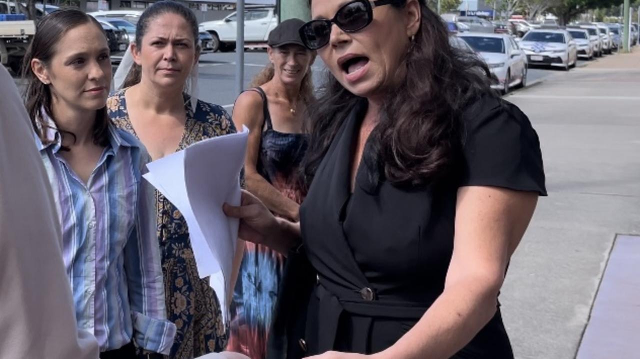 Heidi Ward (black dress) engaging with media outside Mackay court house where she was supporting Jessica Blinda Polsoni Hanbury (striped shirt). Picture: Fergus Gregg