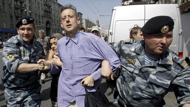 Peter Tatchell has been protesting anti-gay regimes for decades, seen here being detained by Russian riot police. Picture: AP