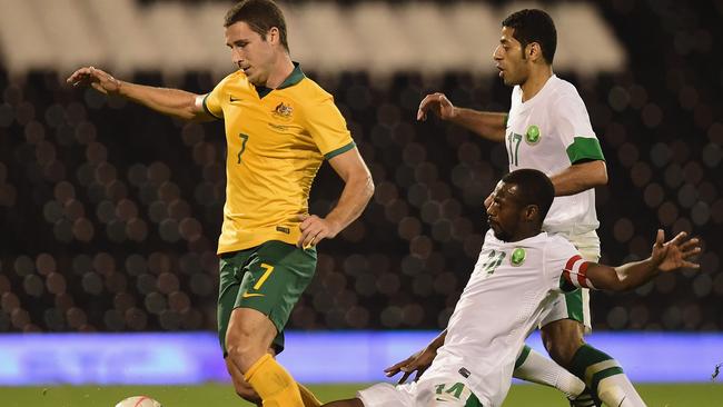 LONDON, ENGLAND - SEPTEMBER 08: Mathew Leckie of Australia battles with Saud Kariri of Saudi Arabia during the International Friendly match between Saudi Arabia and Australia at Craven Cottage on September 8, 2014 in London, England. (Photo by Jamie McDonald/Getty Images)