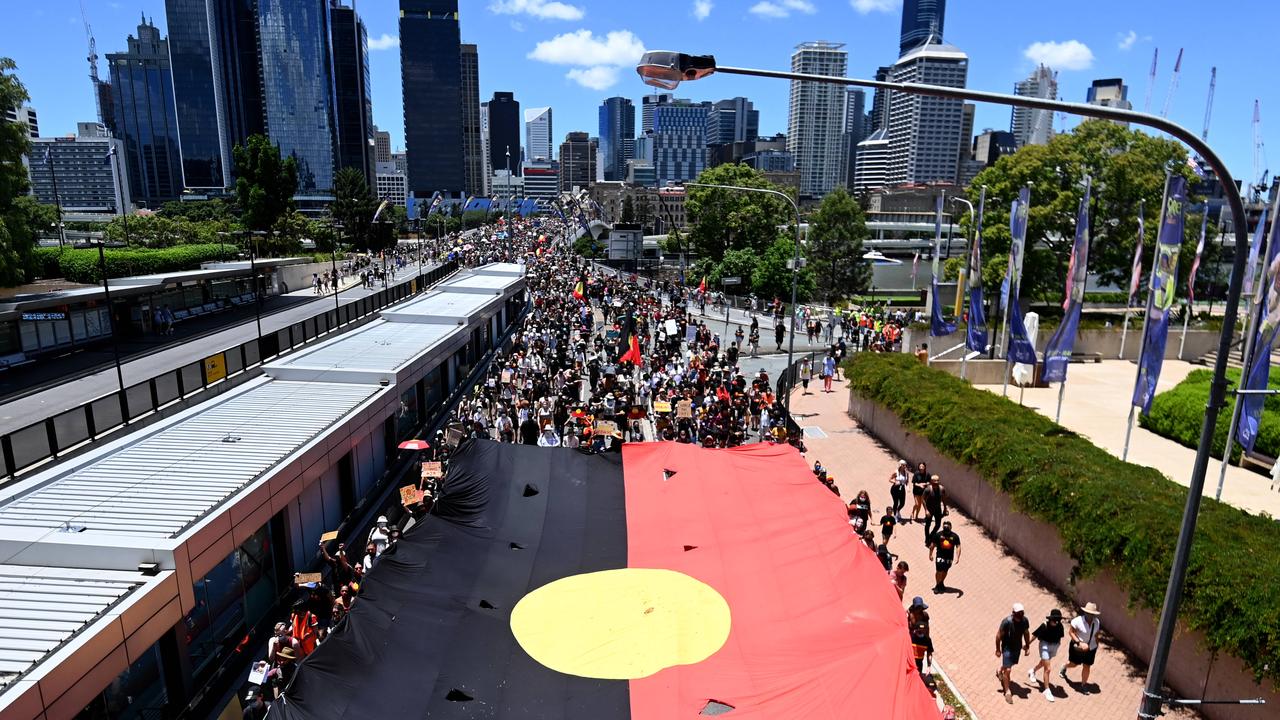 Protesters cross Victoria Bridge as they take part in an Invasion Day march through central Brisbane. Picture: NCA NewsWire / Dan Peled.