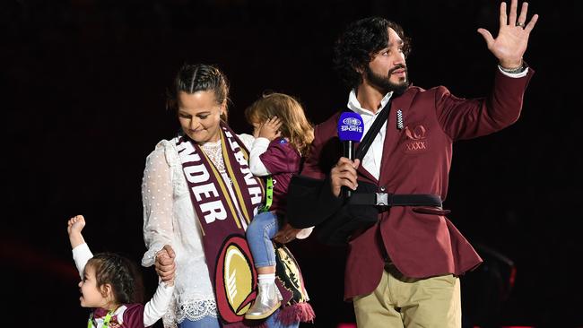 Johnathan Thurston stands with his family during a tribute prior to State of Origin Game 3. Photo: AAP