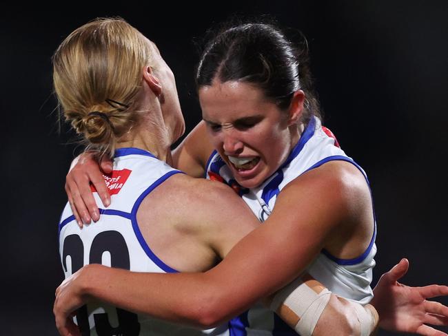 MELBOURNE, AUSTRALIA - NOVEMBER 08: Bella Eddey of the Kangaroos celebrates with Kate Shierlaw of the Kangaroos after kicking a goal during the AFLW Qualifying Final match between North Melbourne Kangaroos and Adelaide Crows at Ikon Park, on November 08, 2024, in Melbourne, Australia. (Photo by Daniel Pockett/Getty Images)