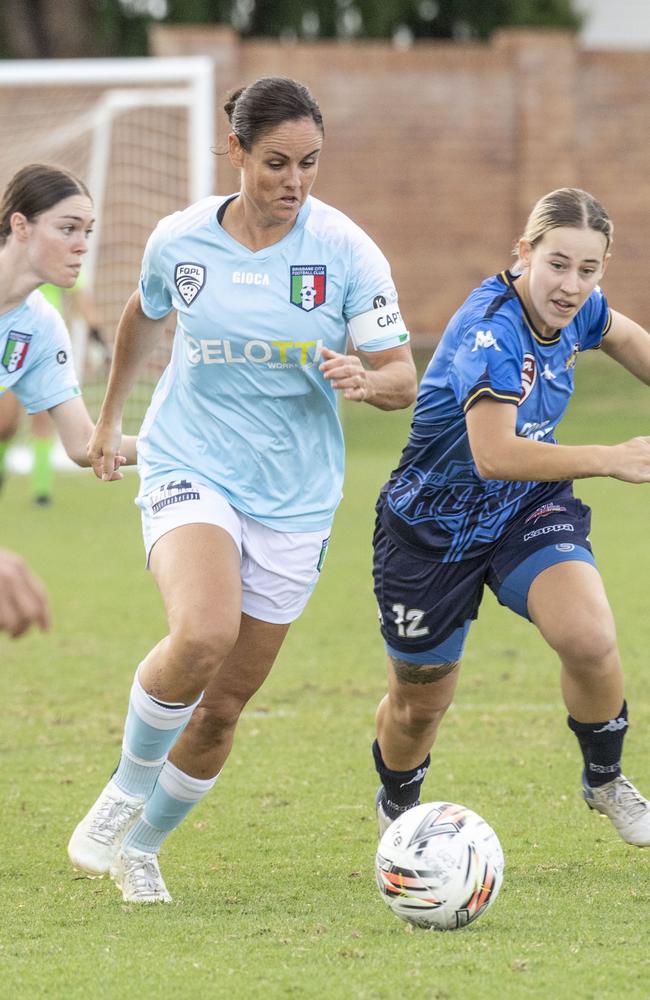 Stephanie Latham for Brisbane and Casey Evans for Thunder. Picture: Nev Madsen.