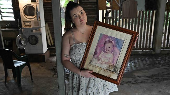 2/122024: Caitlin Thorn, 21, under her home  after being rapidly flooded yesterday, damaging family photographs, and other items,  in Holland Park, Brisbane. pic: Lyndon Mechielsen/Courier Mail