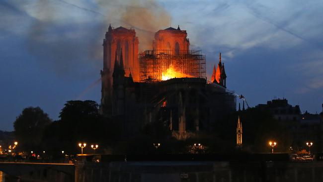 Firefighters tackle the blaze at Notre Dame. Picture: AP.