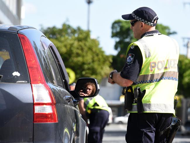 Police check cars at the Queensland border with NSW. Picture: Steve Holland