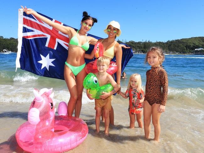 Varsity friends Nicole Hance and Tahnee Stewart with children Tyee Hance (4), Miesha Hance (2) and Milli Madam (5) celebrating Australia Day at Tallebudgera Creek Photo: Scott Powick.