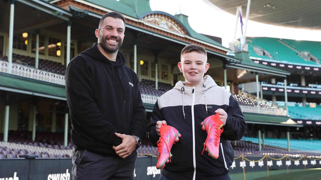 Swysh ambassador James Tedesco gave Starlight child Jack a signed pair of his boots this week. Picture: Brett Costello