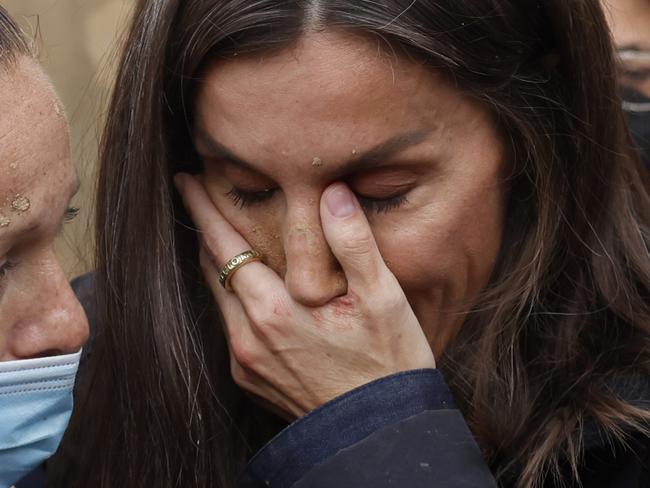 Spain's Queen Letizia reacts as she conforts a woman affected by the floods in Paiporta, near Valencia, Spain, Sunday Nov. 3, 2024. A crowd of angry survivors of Spain's floods have tossed mud and shouted insults at Spain's King Felipe VI and government officials when they made their first visit to one of the hardest hit towns. (Ana Escobar/EFE via AP)